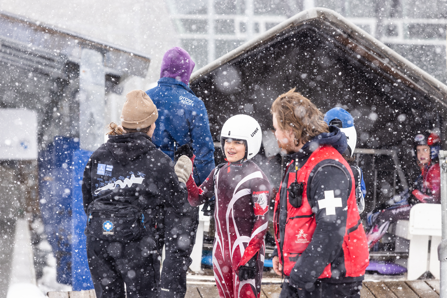 kid meeting coaches for training and it's snowing